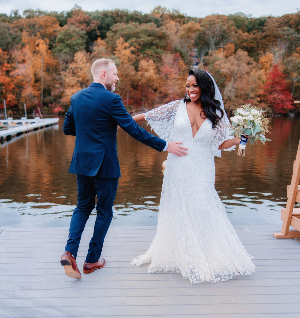 Captured by the best NYC based wedding photographer, a captivating moment of a couple gracefully dancing amidst the beauty of autumn during their enchanting wedding celebration.