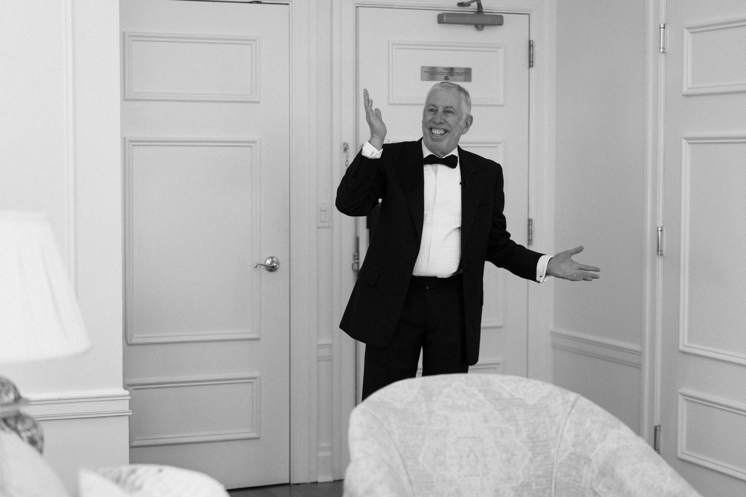 Colette's father reacting as he sees her in her wedding dress