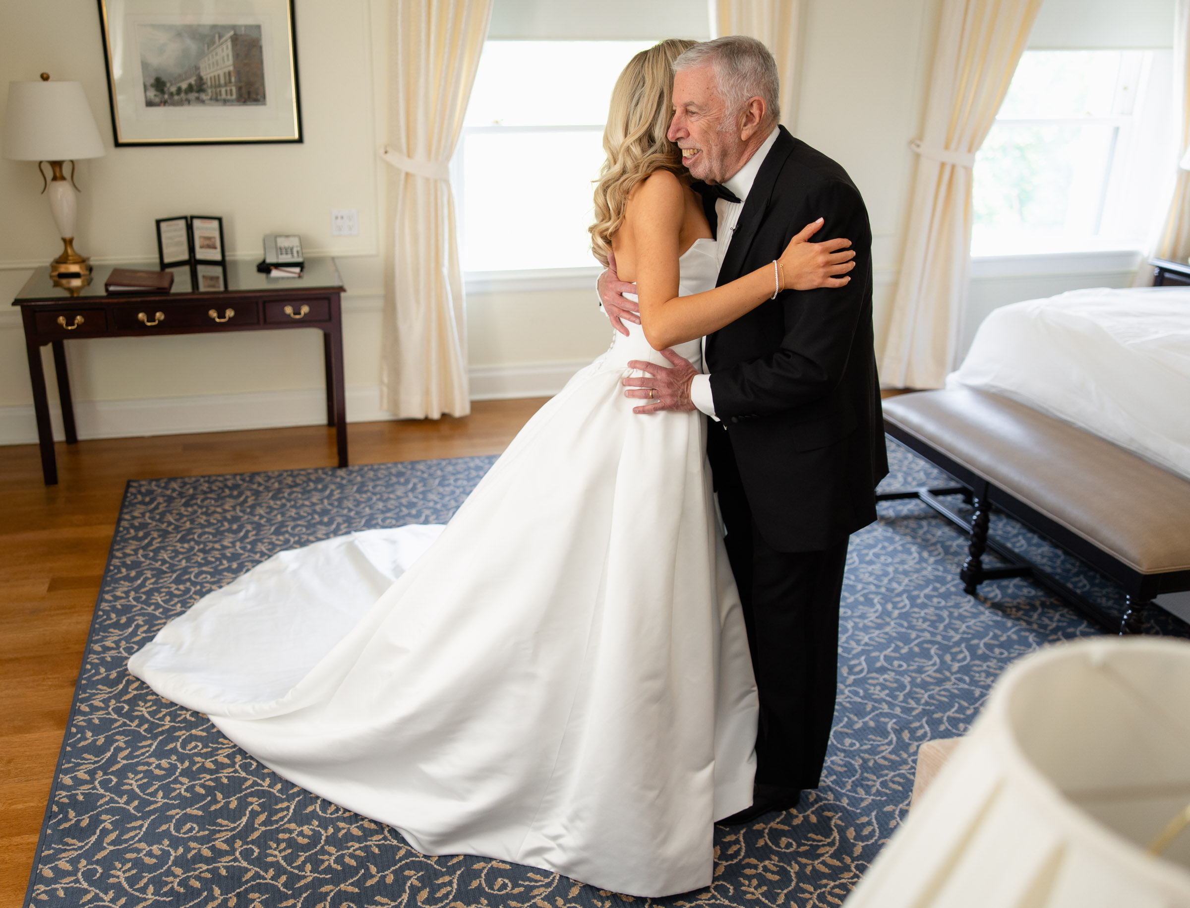 Colette embracing her father during a first look
