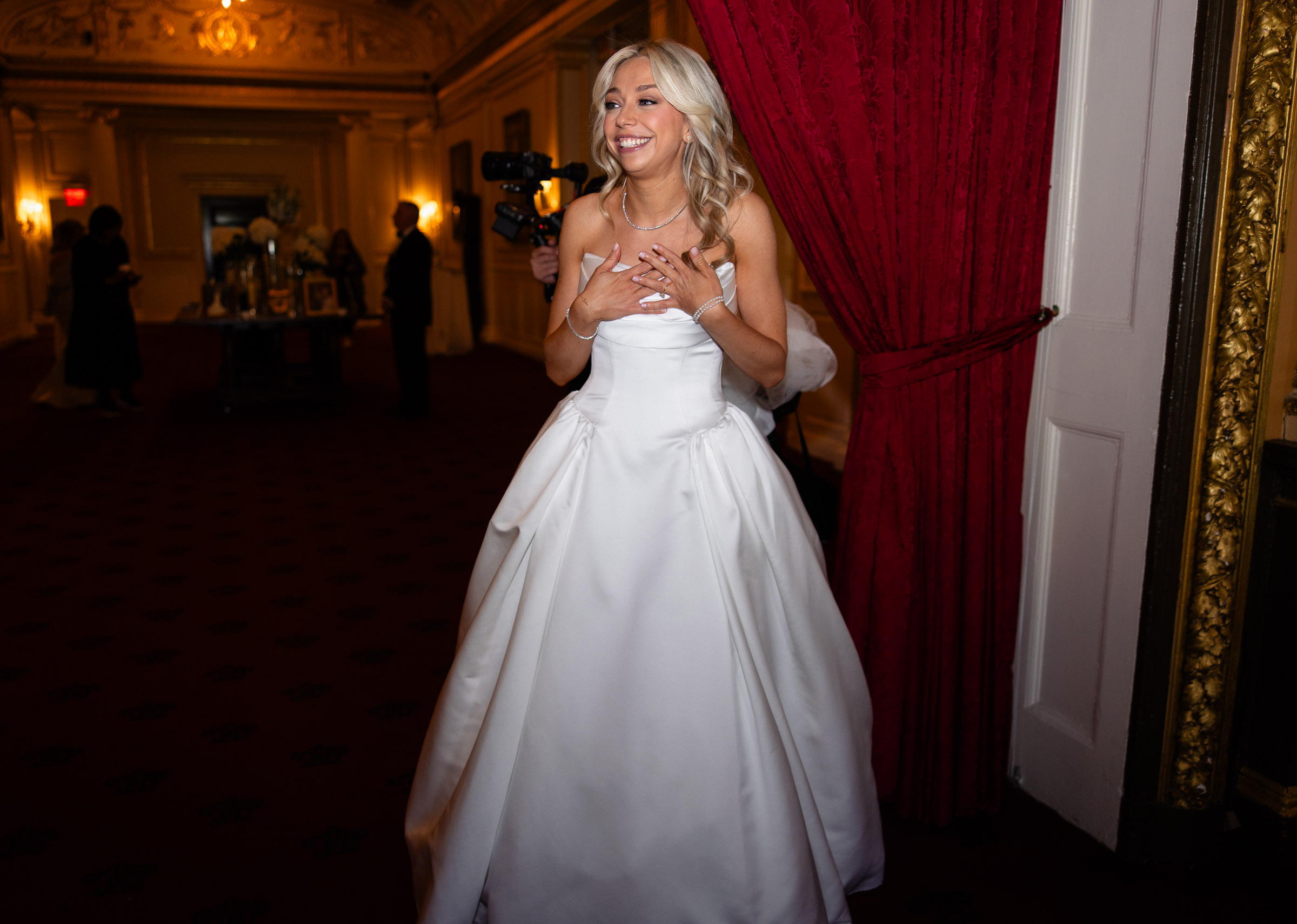 Colette entering an ornate room at the Metropolitan Club