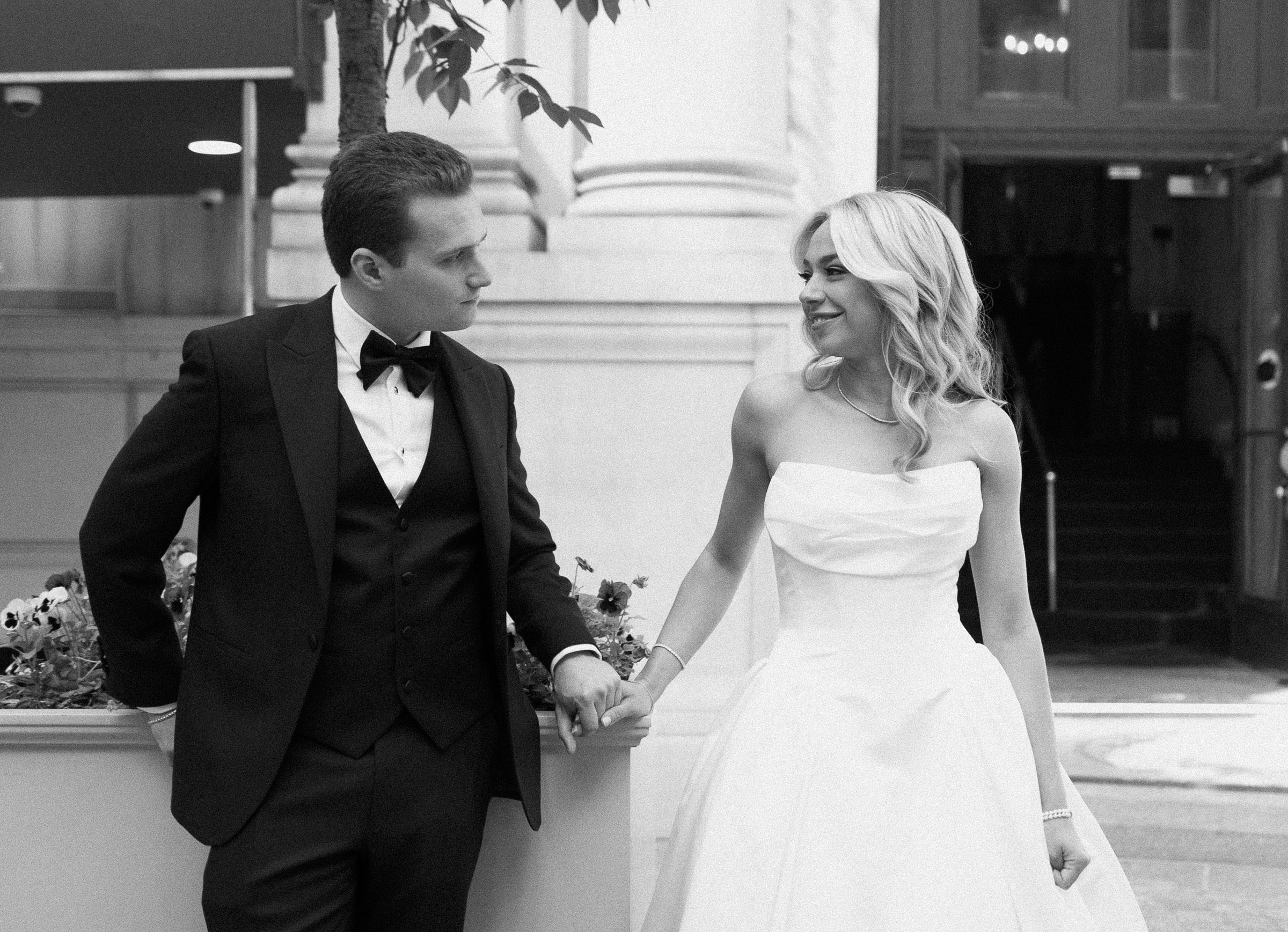 Colette and Cameron walking outside the Metropolitan Club entrance