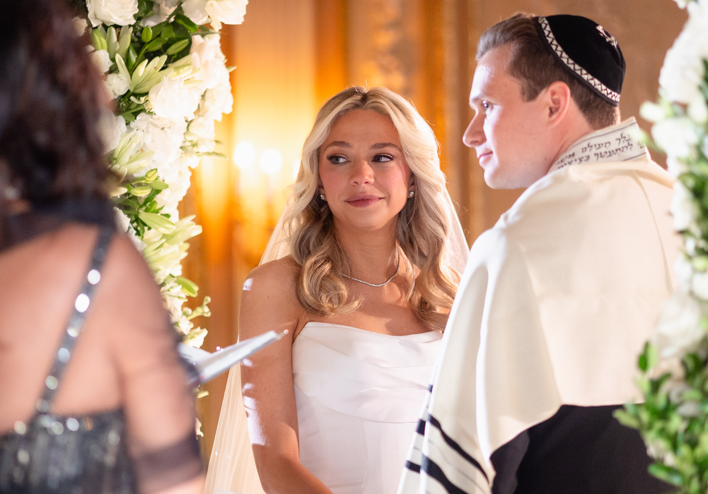 Colette looking at Cameron during the Jewish wedding ceremony