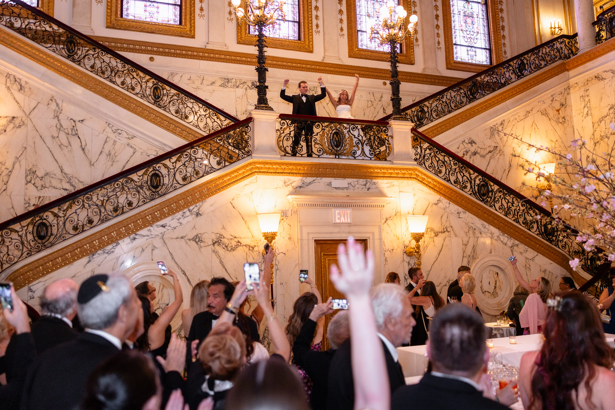 Colette and Cameron making their reception entrance on the grand staircase