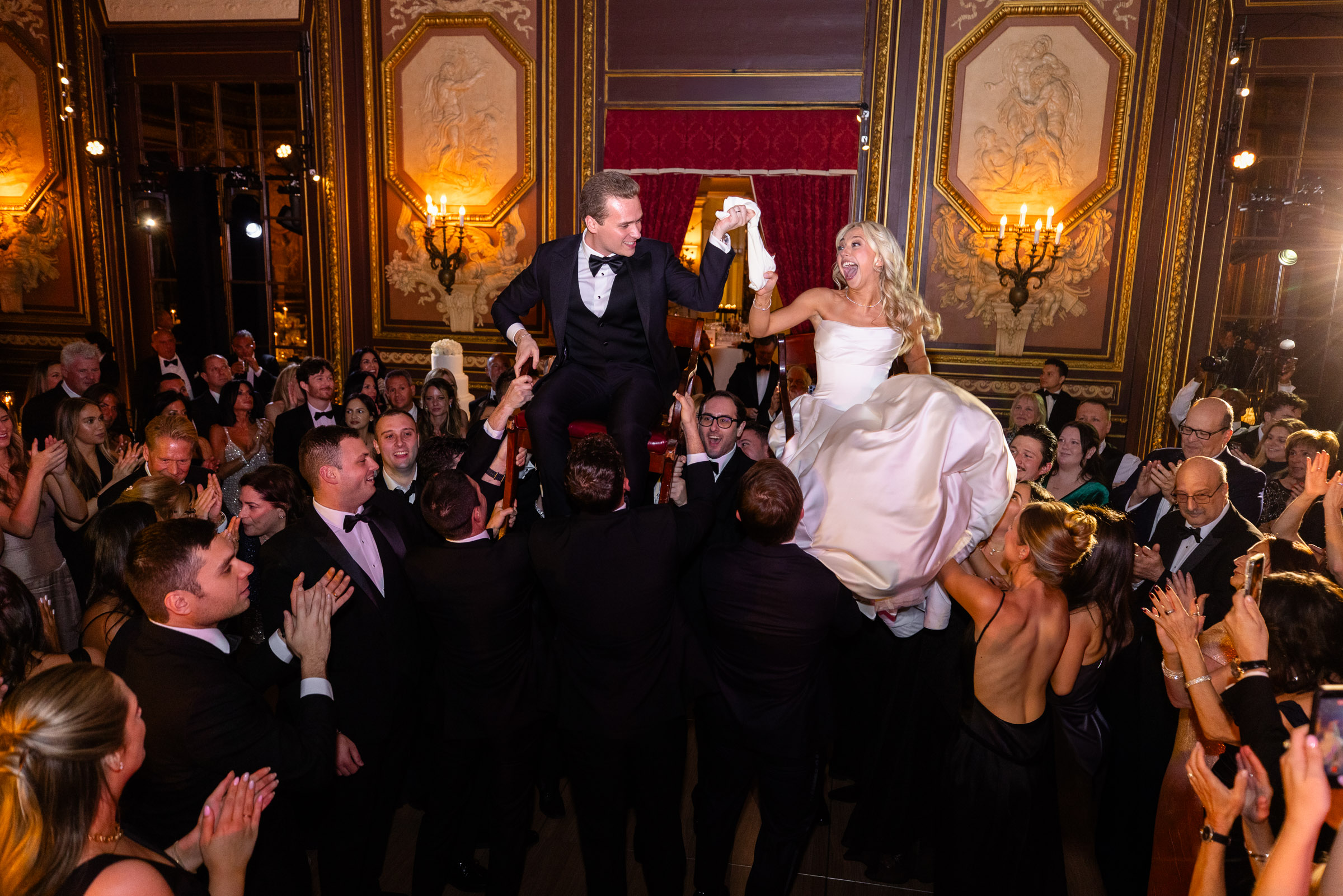 Colette lifted in a chair during the hora