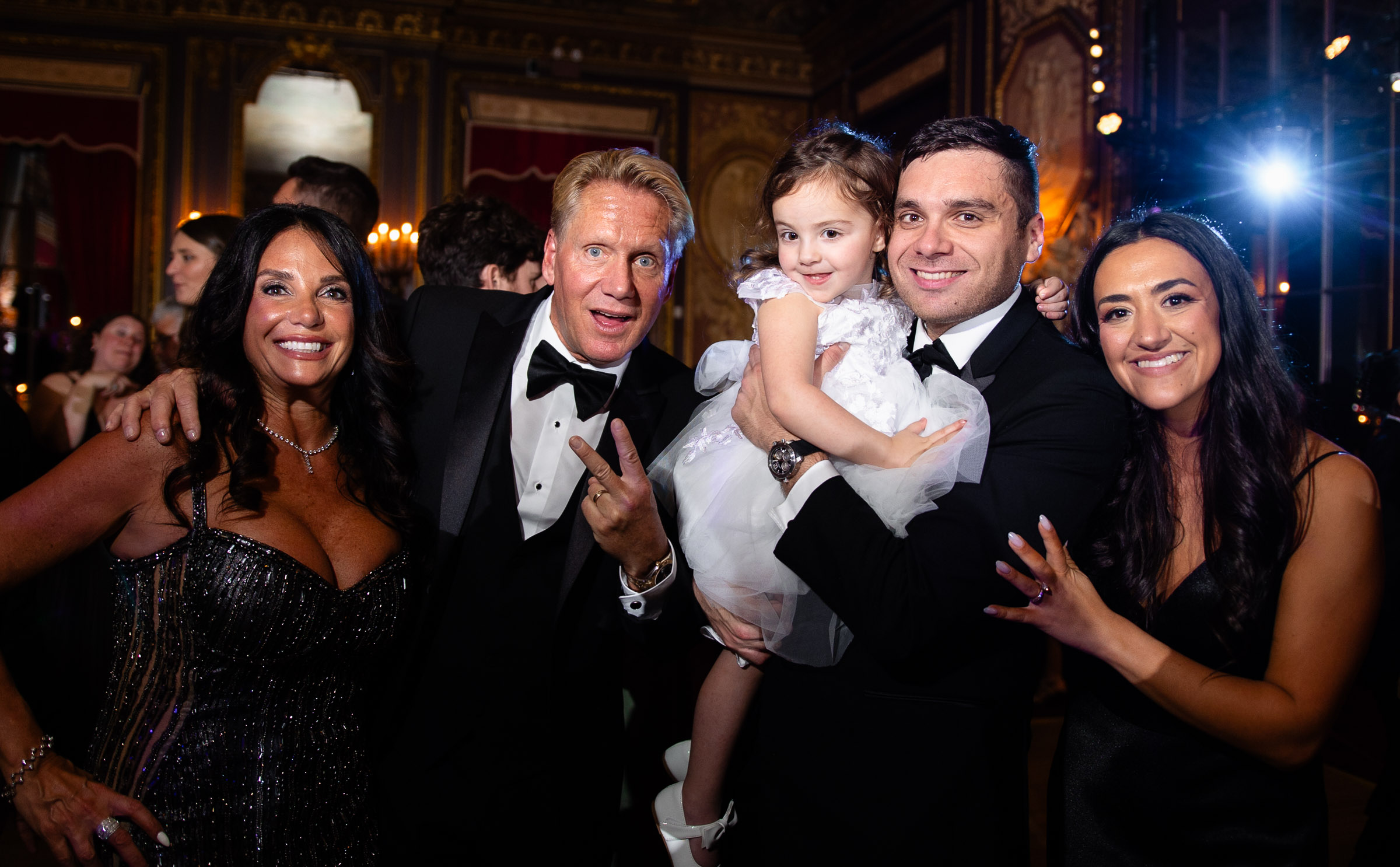 Family members smiling together on the dance floor