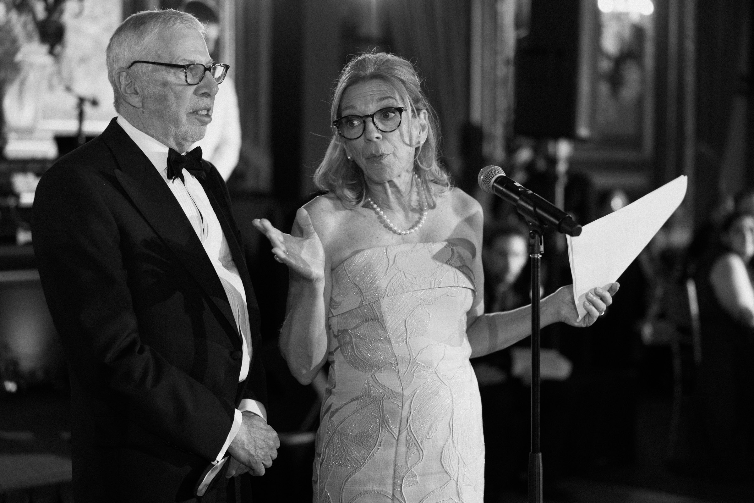 Black-and-white photograph of family members giving a wedding speech