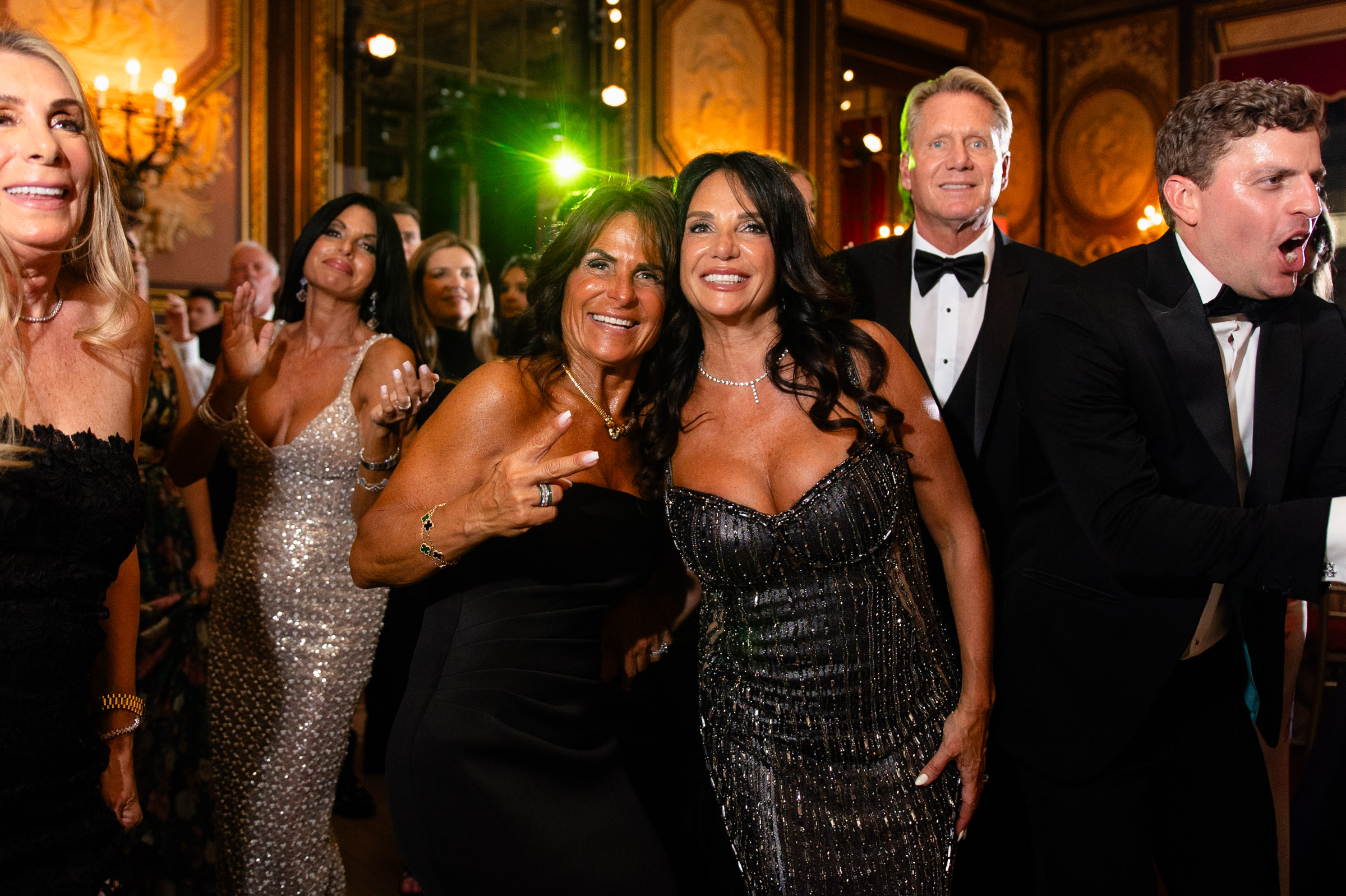 Guests laughing together during the Metropolitan Club reception