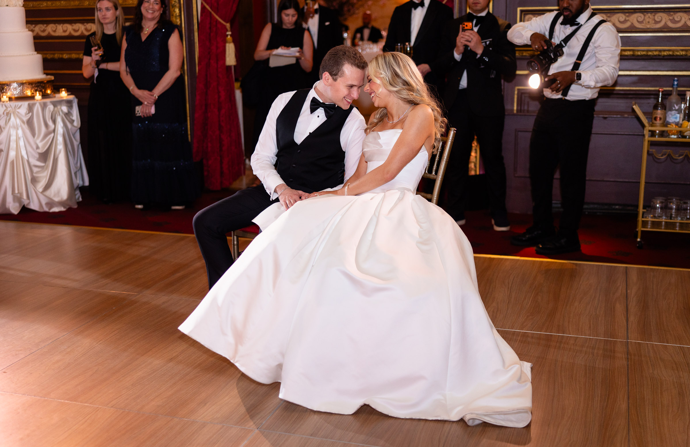 Colette and Cameron dancing together as her skirt moves across the floor
