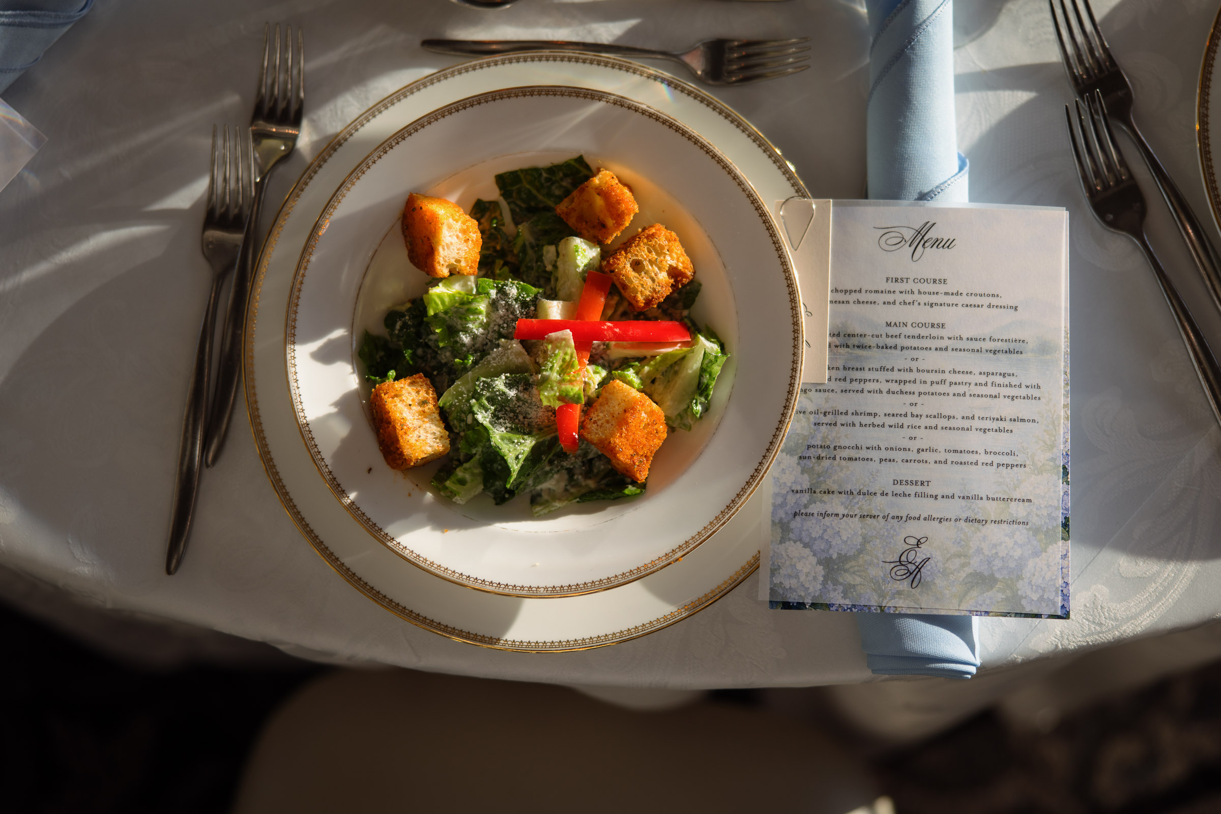 Wedding dinner course presented beside the printed menu