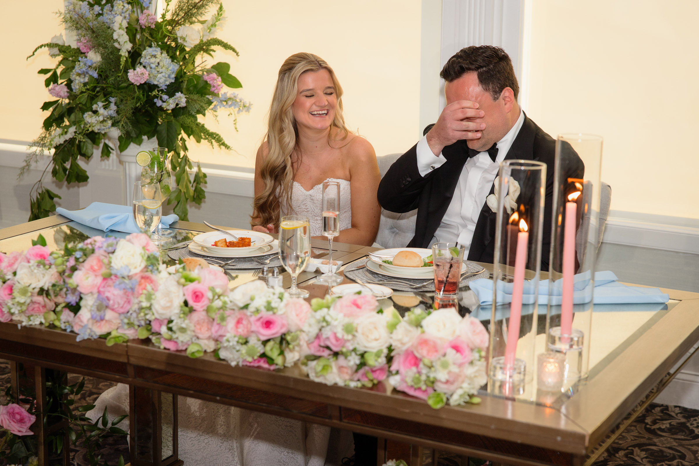 Austin wiping away a tear as Liz smiles during the speeches