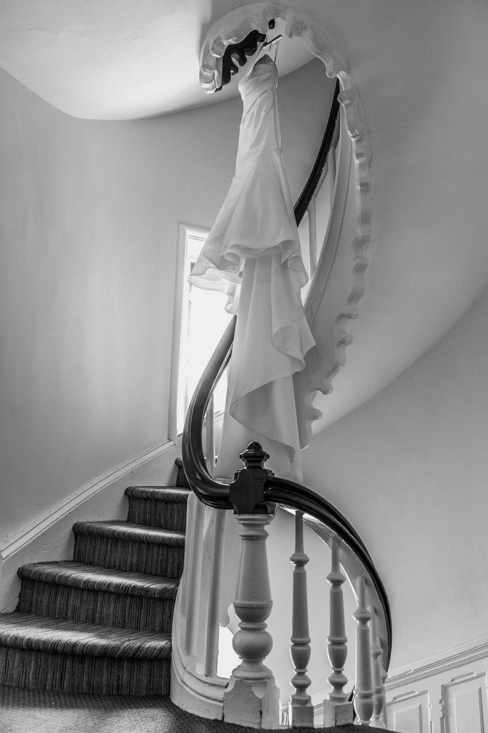 Alexandra’s wedding dress hanging above Whitby Castle’s curved staircase