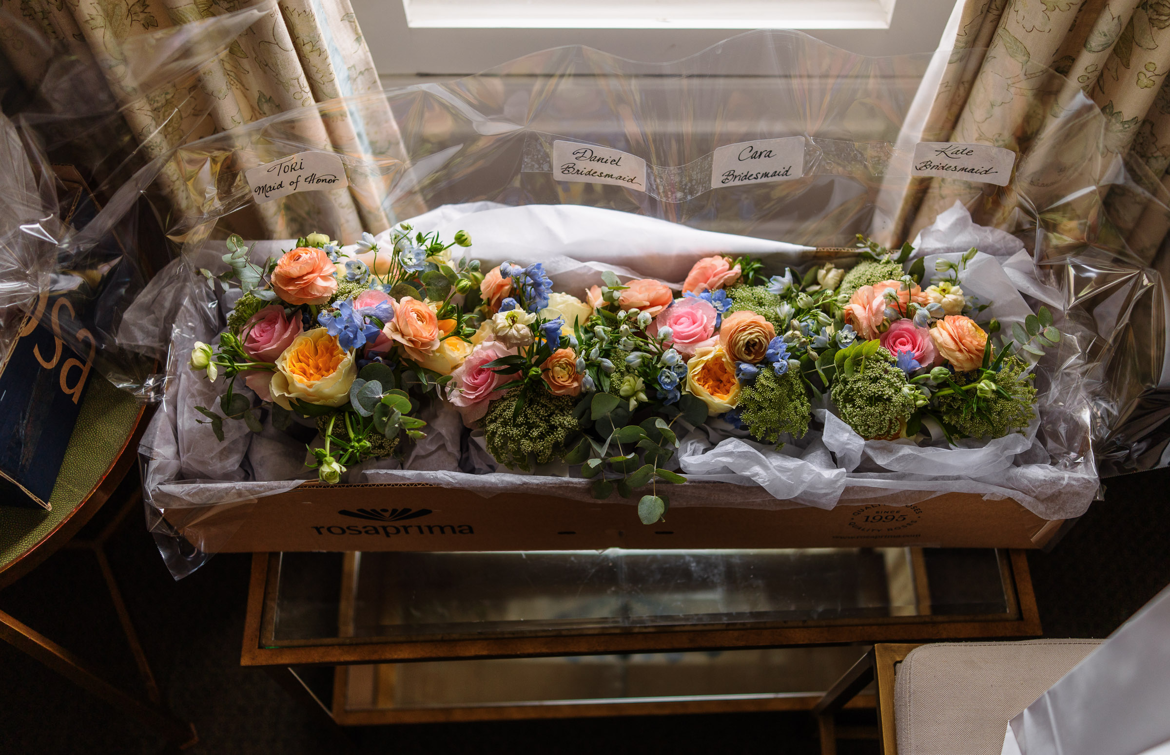 Peach, pink and blue bridal bouquet arranged inside Whitby Castle