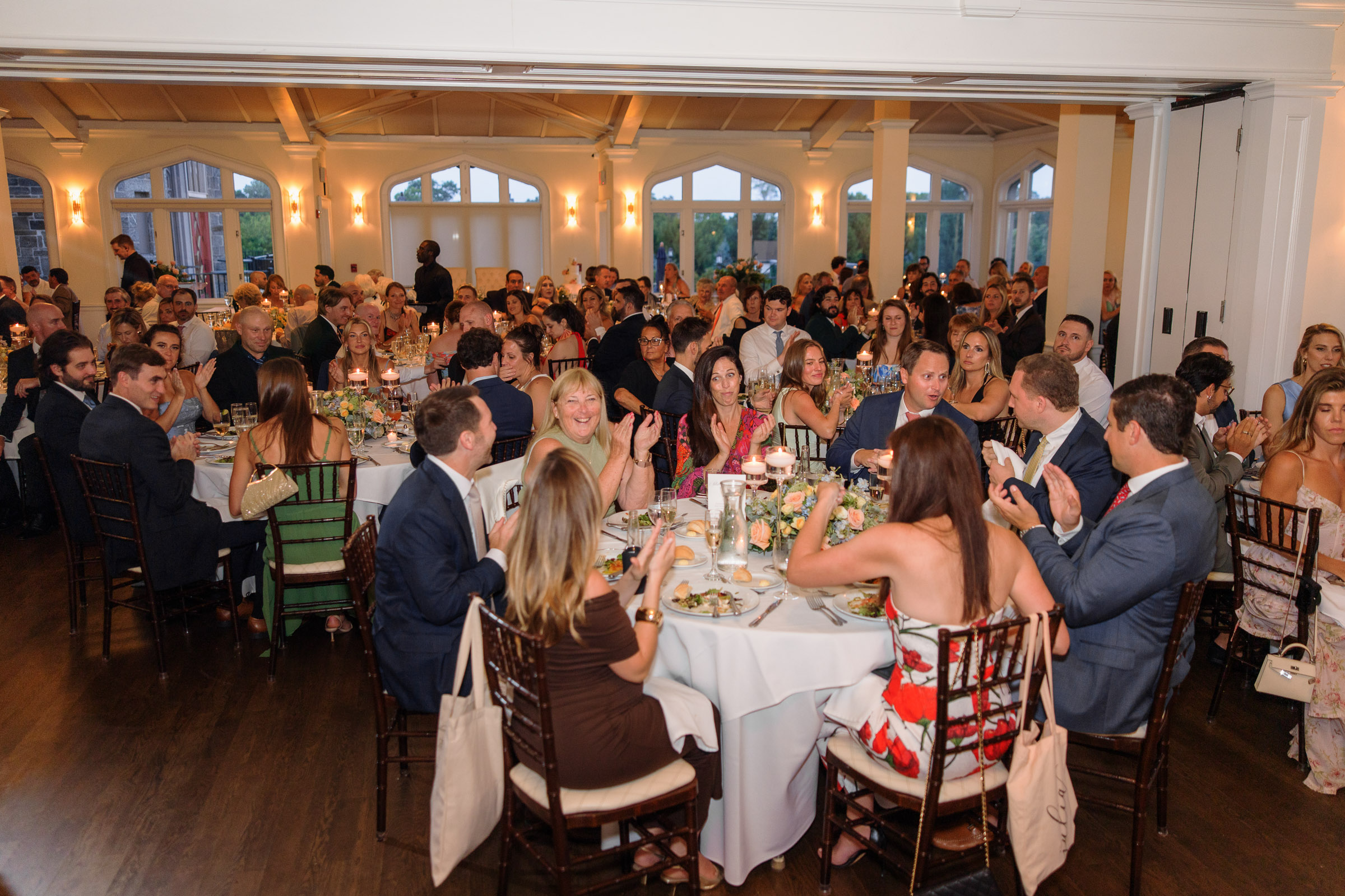 Guests filling the bright Whitby Castle ballroom