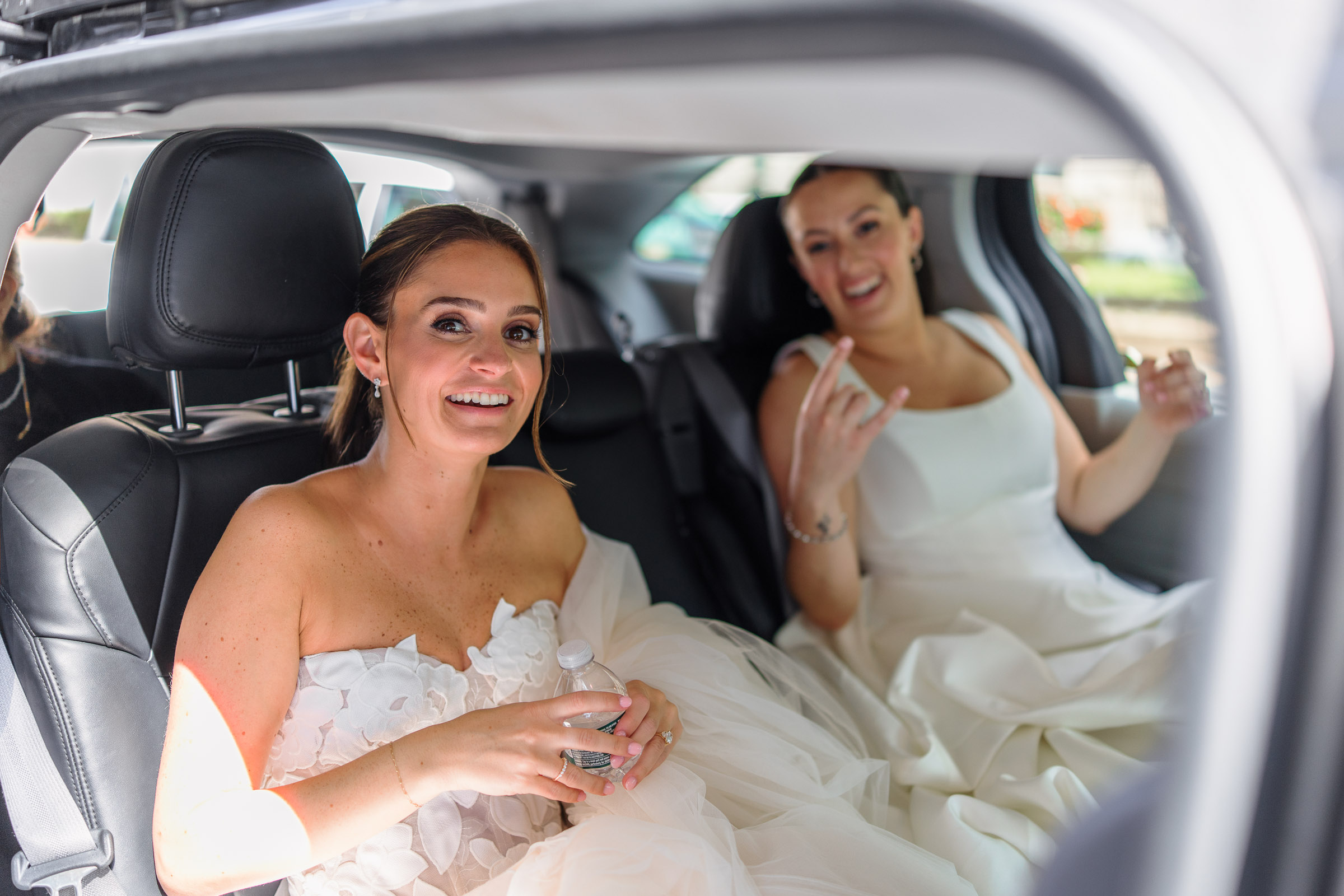 The newlyweds laughing together in the back seat of a New York taxi