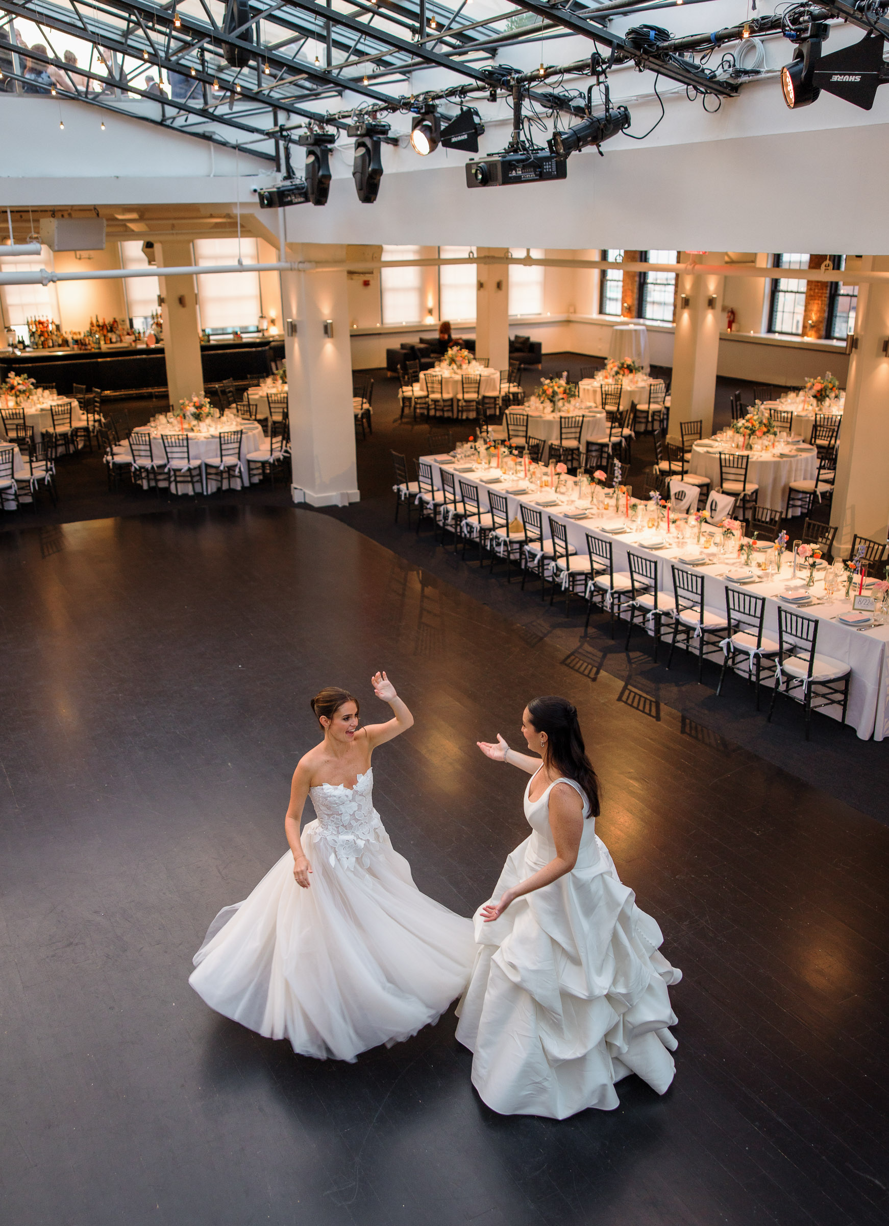 Overhead portrait of Sydney and Delilah dancing in the empty Tribeca Rooftop reception room