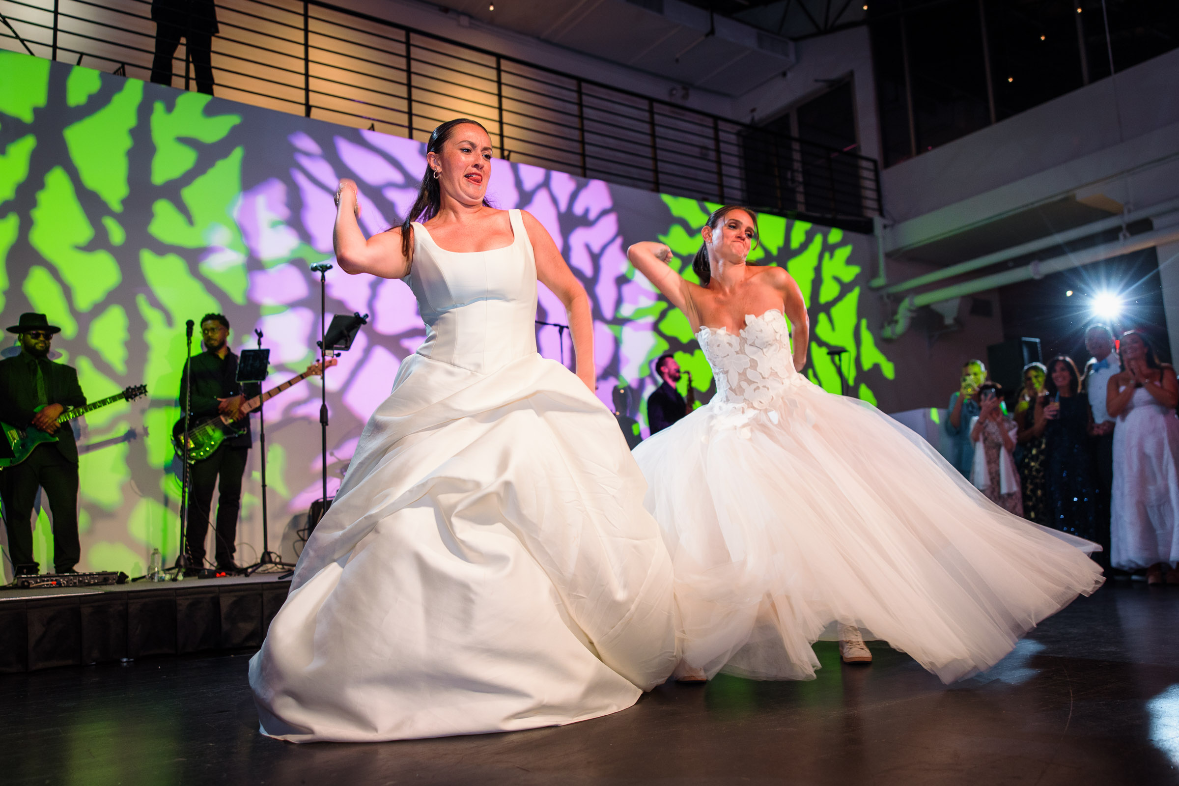 A bride spinning her sculptural gown during the first dance